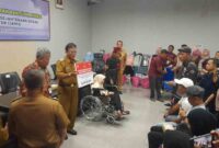Pemberian bantuan untuk disabilitas.